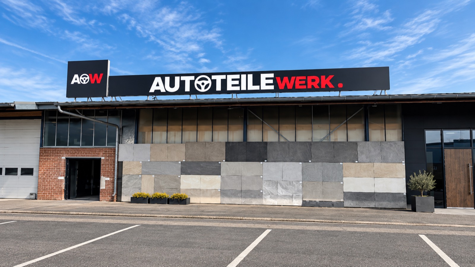 Werbeschild und Außenwerbung für Autoteilewerk: beleuchtete Dachbeschriftung mit Logo und Schriftzug